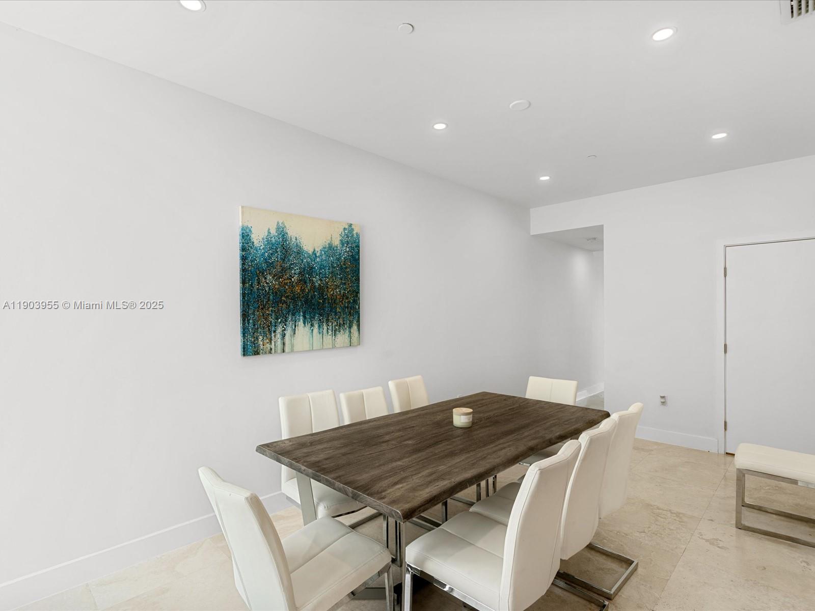 155 North Shore Drive, Unit 1553 Miami Beach, FL 33141 - Photo 10 of 48 a view of a dining room with furniture