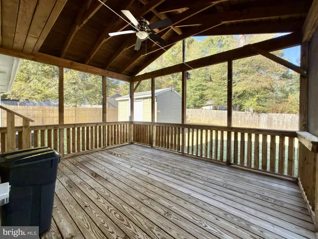 a view of a balcony with wooden floor