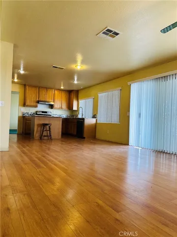 a living room with a sink and a table