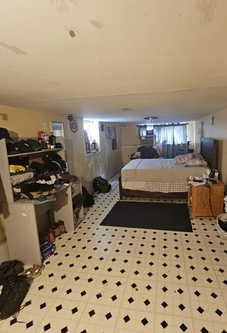 a bedroom with a bed and a cabinets