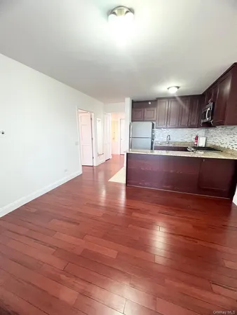 a view of kitchen with wooden floor