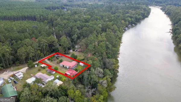 an aerial view of a house with swimming pool