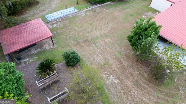 an aerial view of residential house with outdoor space and lake view
