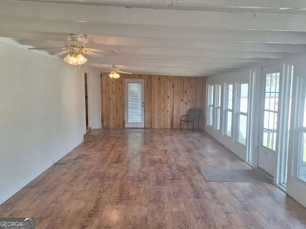 a view of a hallway with an entryway