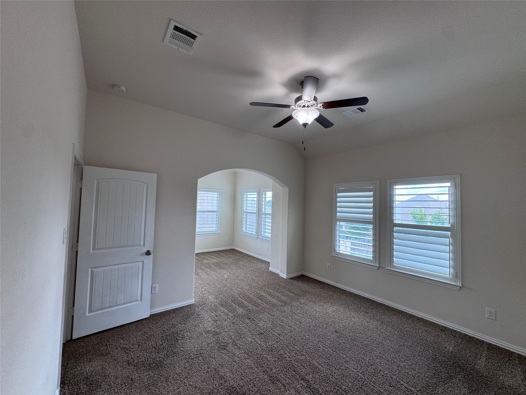 2605 Rough Berry Road Pflugerville, TX 78660 - Photo 30 of 40 A quiet secondary bedroom features carpet flooring and ample natural light through well-appointed windows.