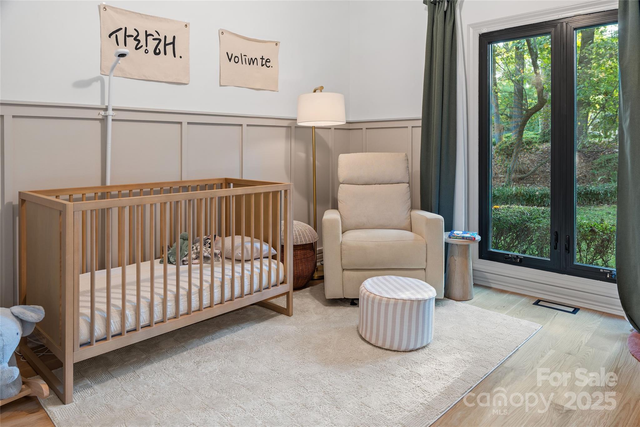 5123 Randolph Road Charlotte, NC 28211 - Photo 13 of 30 a bedroom with a bed and a large window