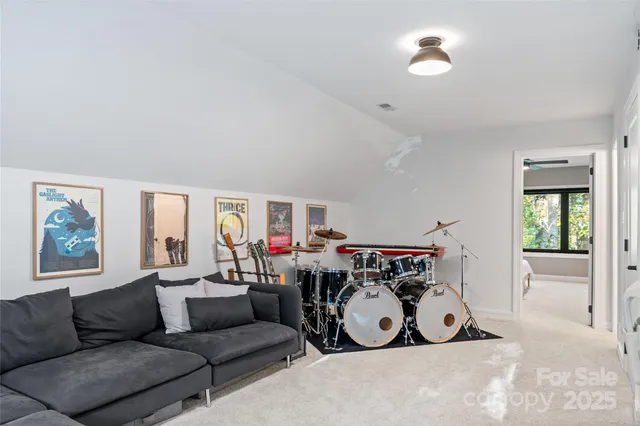 a bedroom with a large bed and a large window