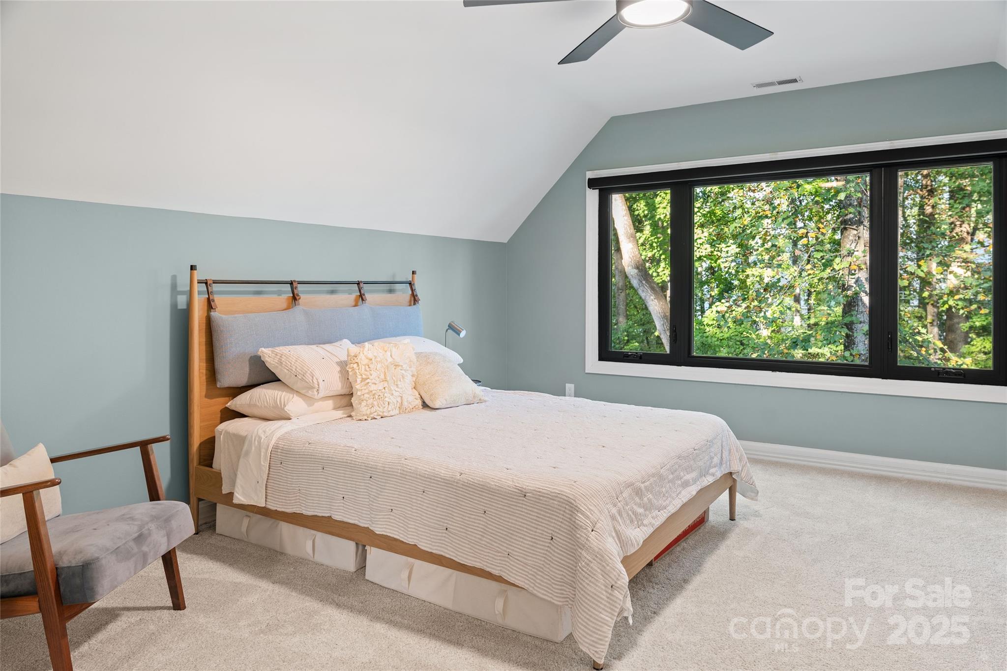 5123 Randolph Road Charlotte, NC 28211 - Photo 19 of 30 a bedroom with a large bed and a large window