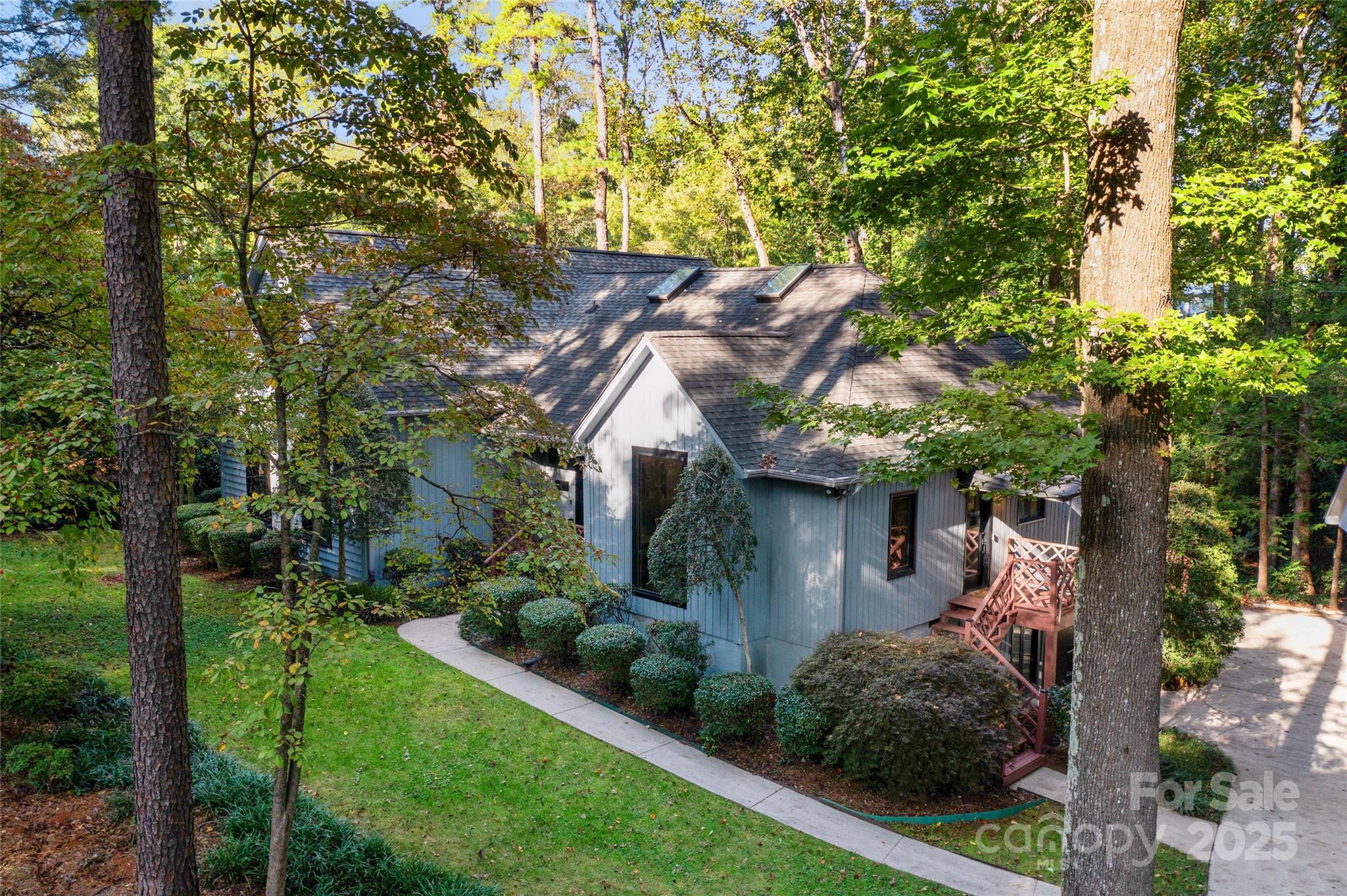 5123 Randolph Road Charlotte, NC 28211 - Photo 22 of 30 a view of a house with a tree and plants