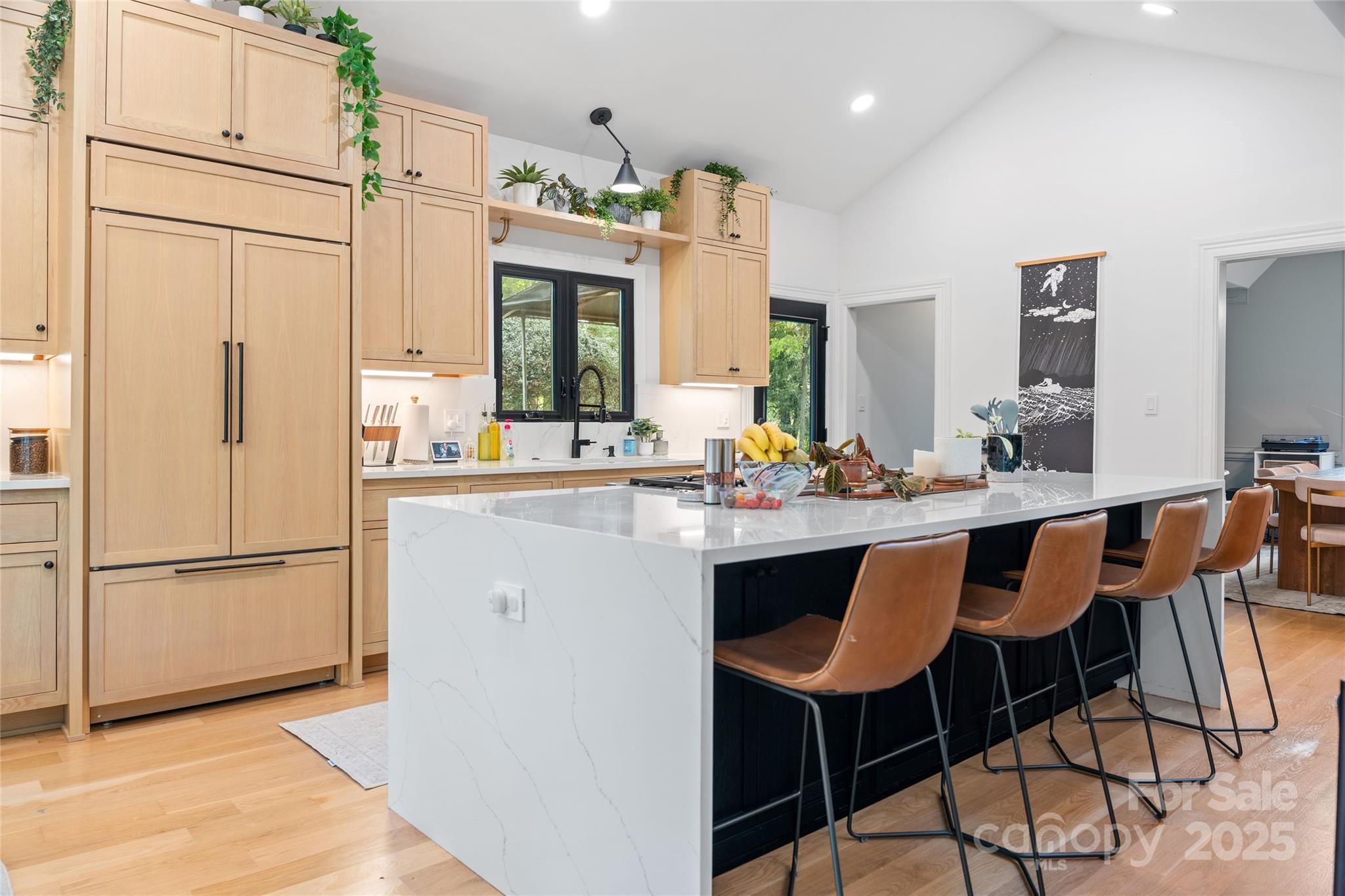 5123 Randolph Road Charlotte, NC 28211 - Photo 3 of 30 a kitchen with stainless steel appliances granite countertop a refrigerator a sink dishwasher a stove with white cabinets and wooden floor