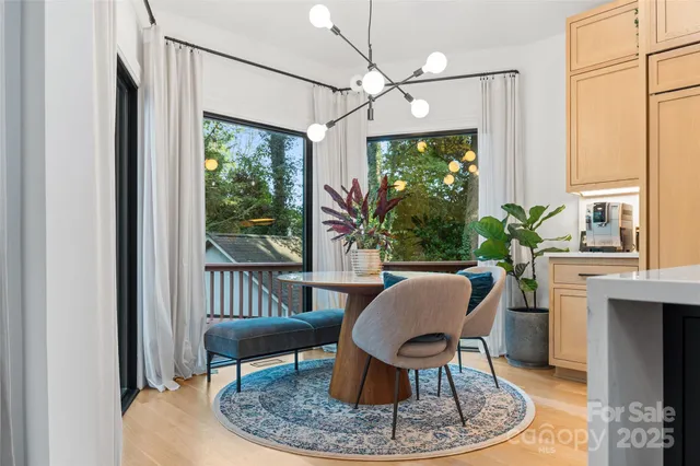 a view of a livingroom with furniture window and wooden floor