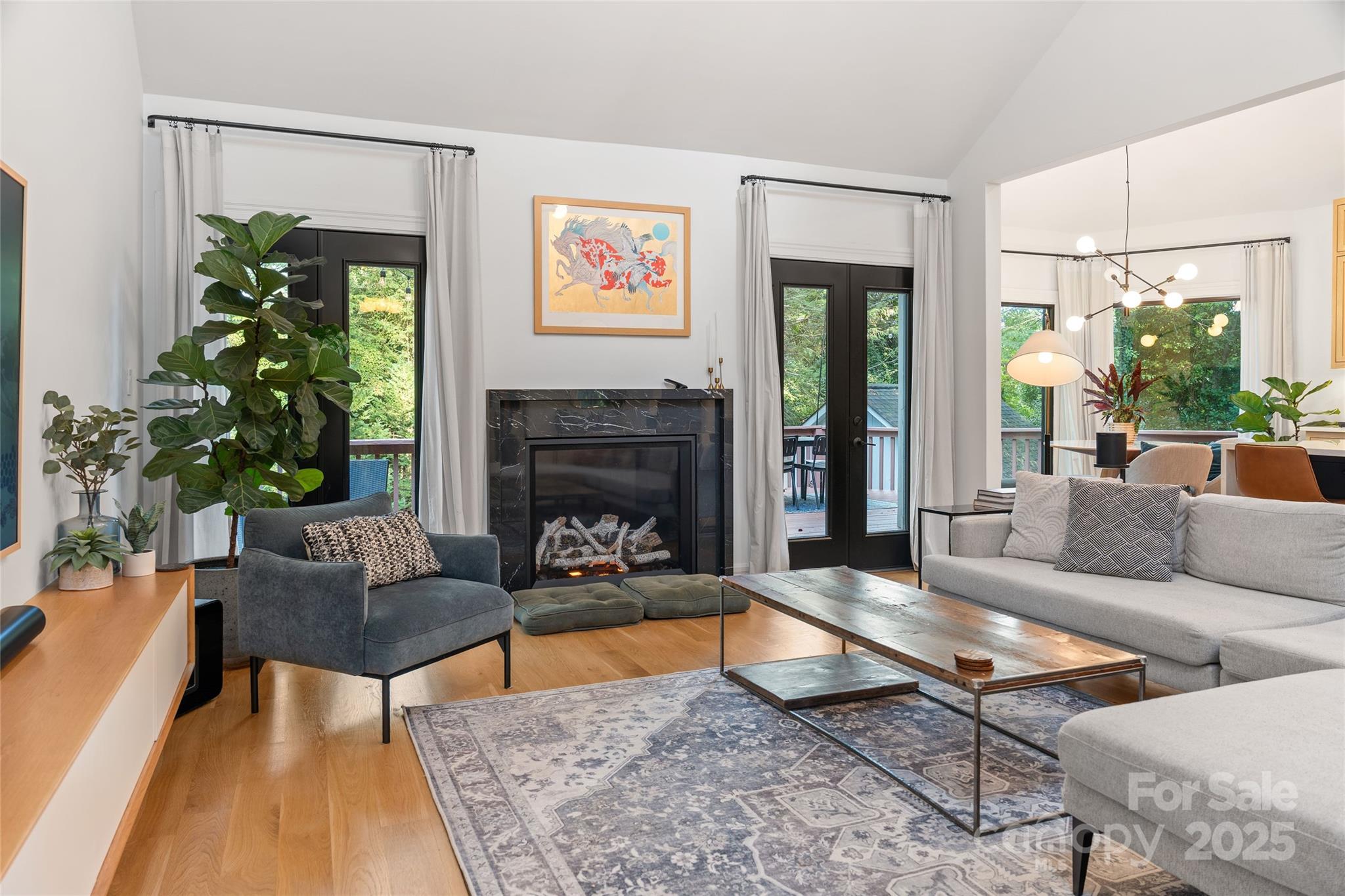 5123 Randolph Road Charlotte, NC 28211 - Photo 7 of 30 a living room with furniture a large window and a fireplace