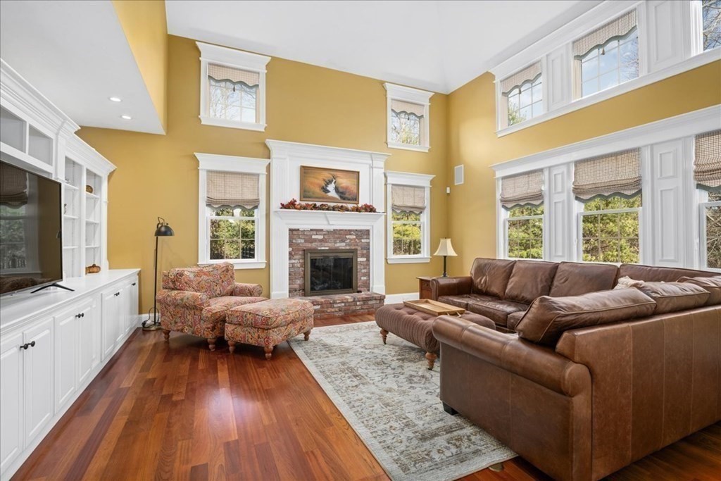 9 Laurel Ridge Lane Shrewsbury, MA 01545 - Photo 12 of 41 a living room with furniture fireplace and a flat screen tv