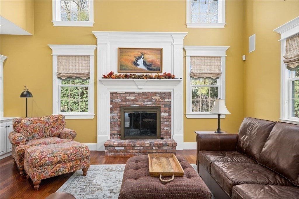 9 Laurel Ridge Lane Shrewsbury, MA 01545 - Photo 13 of 41 a living room with furniture and a fireplace