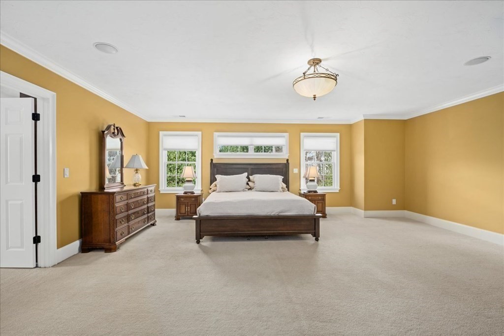 9 Laurel Ridge Lane Shrewsbury, MA 01545 - Photo 22 of 41 a spacious bedroom with a bed and window