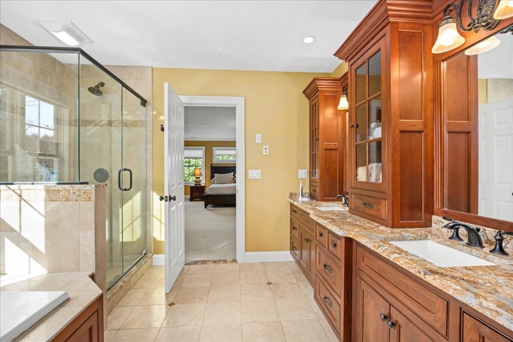 9 Laurel Ridge Lane Shrewsbury, MA 01545 - Photo 23 of 41 a spacious bathroom with a double vanity sink a mirror and a shower