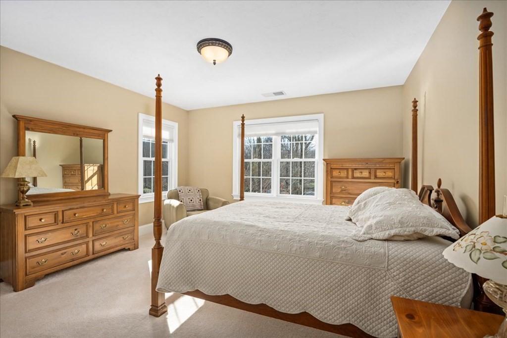 9 Laurel Ridge Lane Shrewsbury, MA 01545 - Photo 25 of 41 a bedroom with a large bed and a window