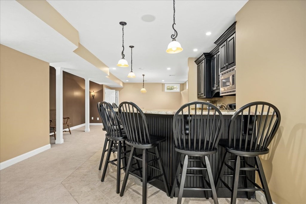 9 Laurel Ridge Lane Shrewsbury, MA 01545 - Photo 30 of 41 a view of a dining room with furniture