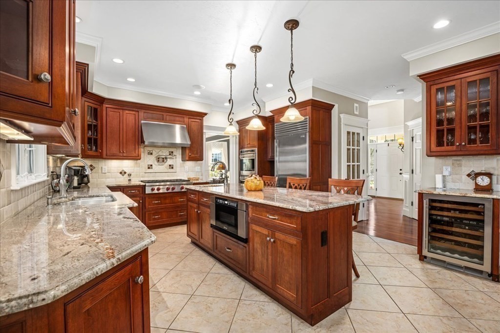 9 Laurel Ridge Lane Shrewsbury, MA 01545 - Photo 5 of 41 a large kitchen with stainless steel appliances granite countertop a stove a sink and a refrigerator