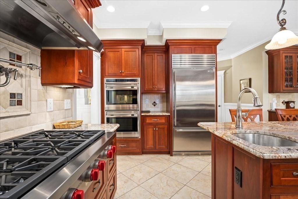 9 Laurel Ridge Lane Shrewsbury, MA 01545 - Photo 6 of 41 a kitchen with stainless steel appliances granite countertop a stove top oven a sink dishwasher and cabinets with wooden floor