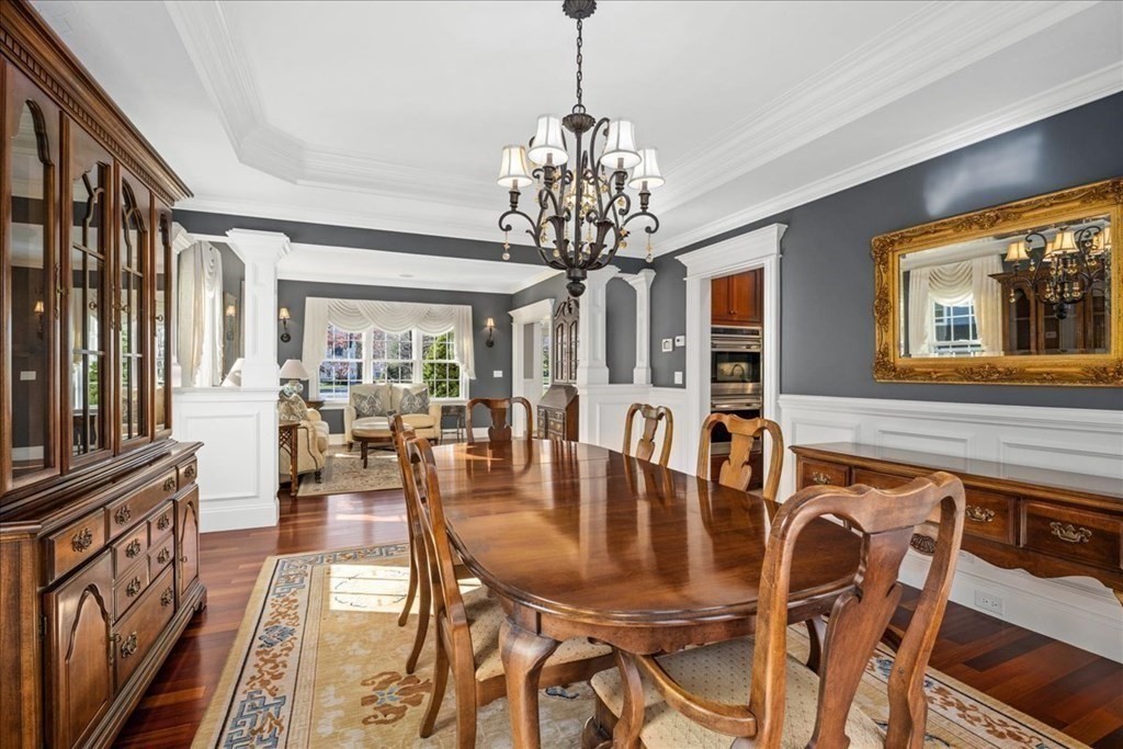 9 Laurel Ridge Lane Shrewsbury, MA 01545 - Photo 9 of 41 a dining room with furniture a chandelier and wooden floor