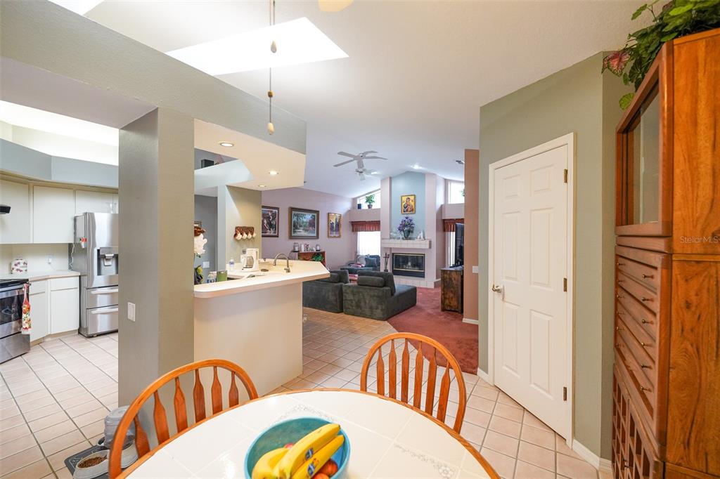 7340 Flyway Drive Spring Hill, FL 34607 - Photo 12 of 32 a view of a kitchen and dining room