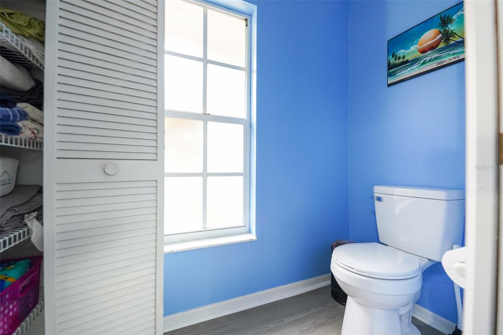 7340 Flyway Drive Spring Hill, FL 34607 - Photo 18 of 32 a white toilet sitting next to a window