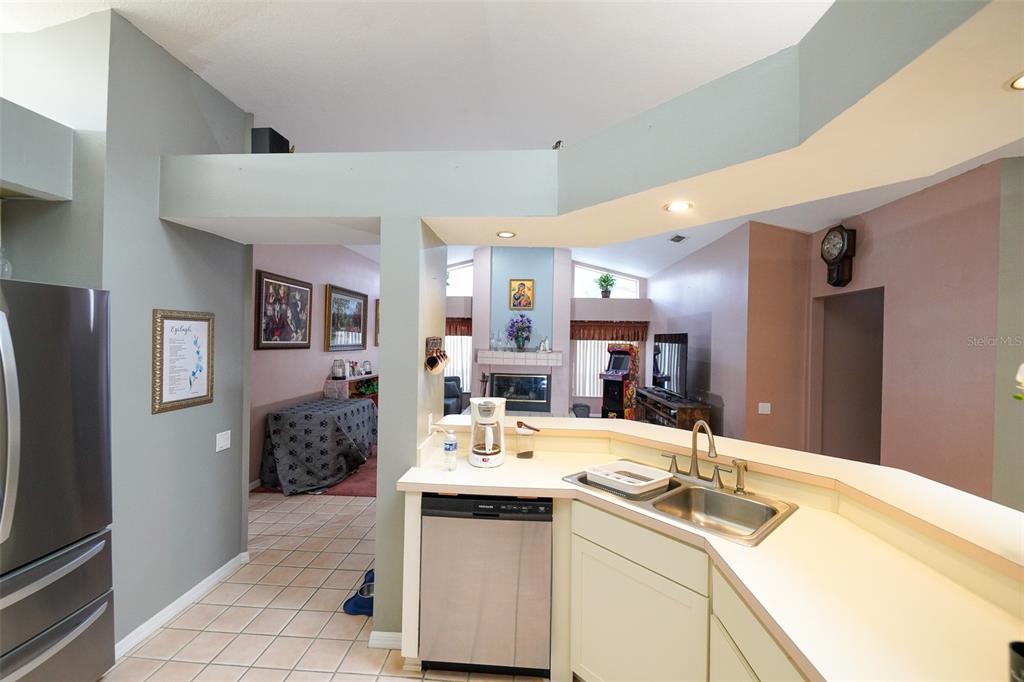 7340 Flyway Drive Spring Hill, FL 34607 - Photo 10 of 32 a bathroom with a sink double vanity granite and a mirror