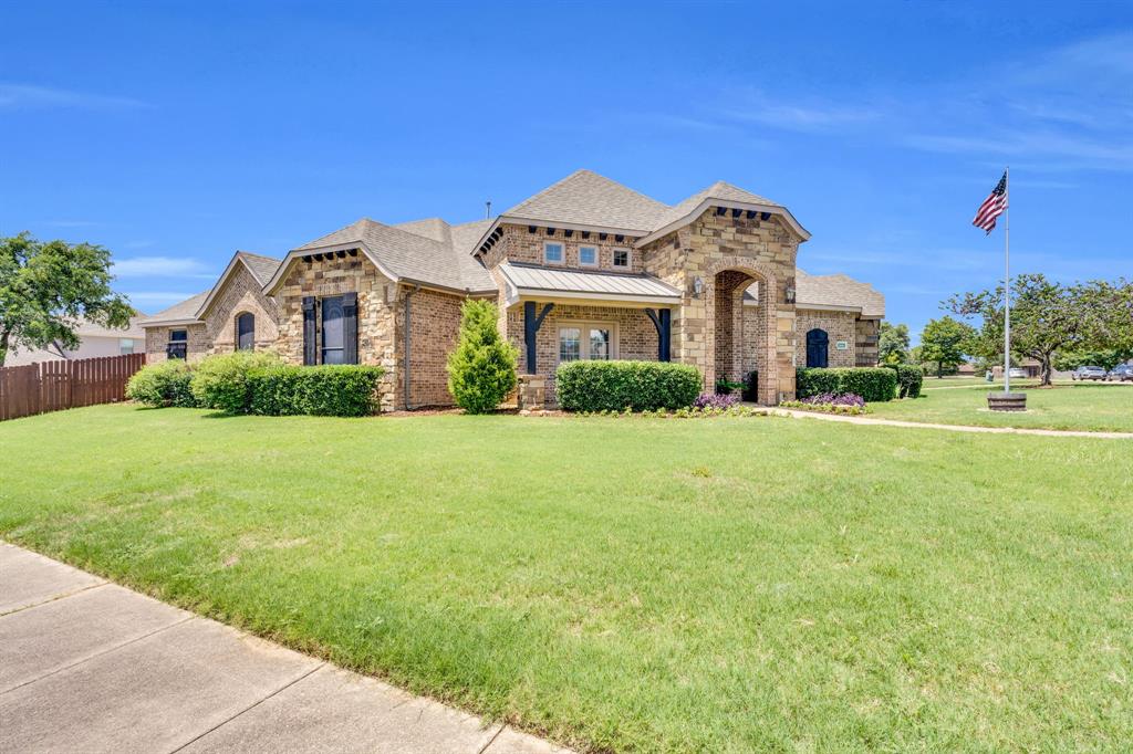 a front view of a house with a yard