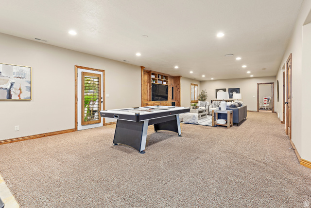 552 East Johns Way Sandy, UT 84070 - Photo 43 of 67 Spacious recreation room featuring recessed lighting and neutral carpeting