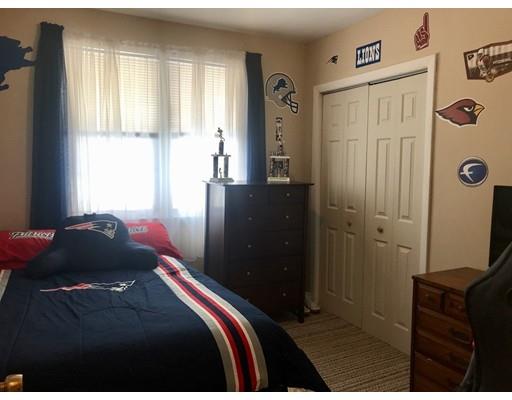 23 Inwood Road Rutland, MA 01543 - Photo 12 of 20 a bedroom with a bed and wooden floor