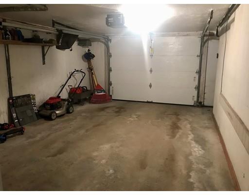 23 Inwood Road Rutland, MA 01543 - Photo 18 of 20 a view of a garage with rack