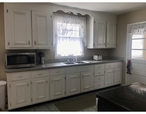 23 Inwood Road Rutland, MA 01543 - Photo 5 of 20 a kitchen with granite countertop white cabinets and window