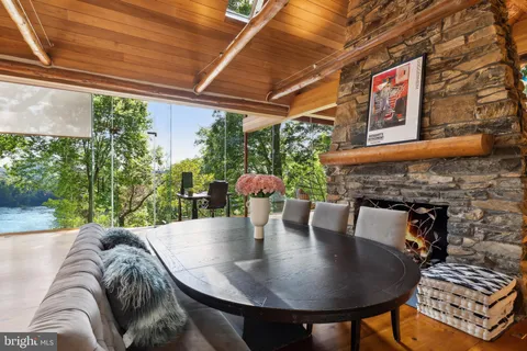 a outdoor dining space with furniture and outdoor view