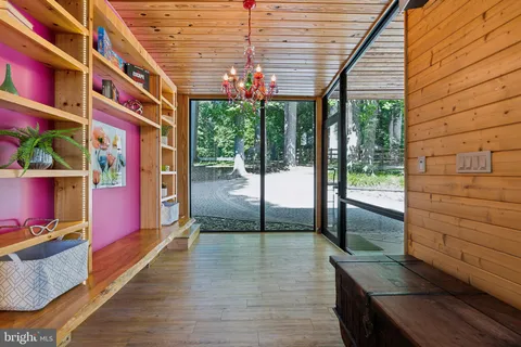 a view of a porch with wooden floor and outdoor space