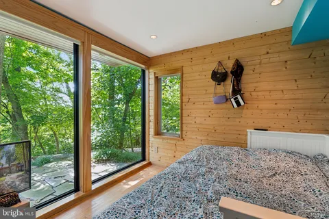 a bathroom with a tub and window