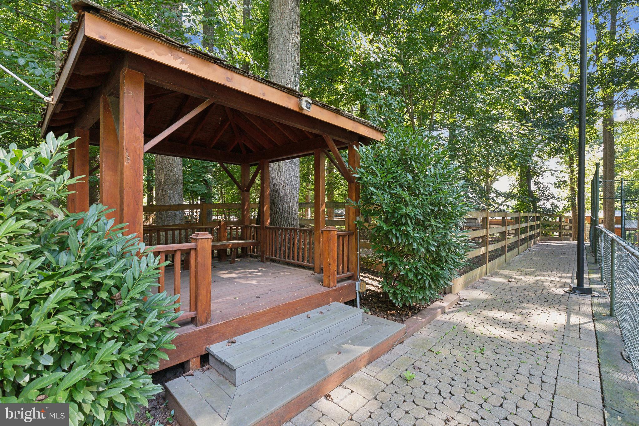 11540 Springridge Road Potomac, MD 20854 - Photo 25 of 35 a patio with wooden fence and plants