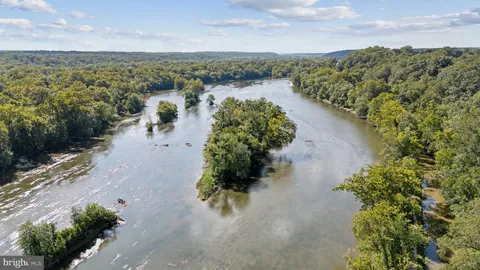 a view of a lake with mountains in the background