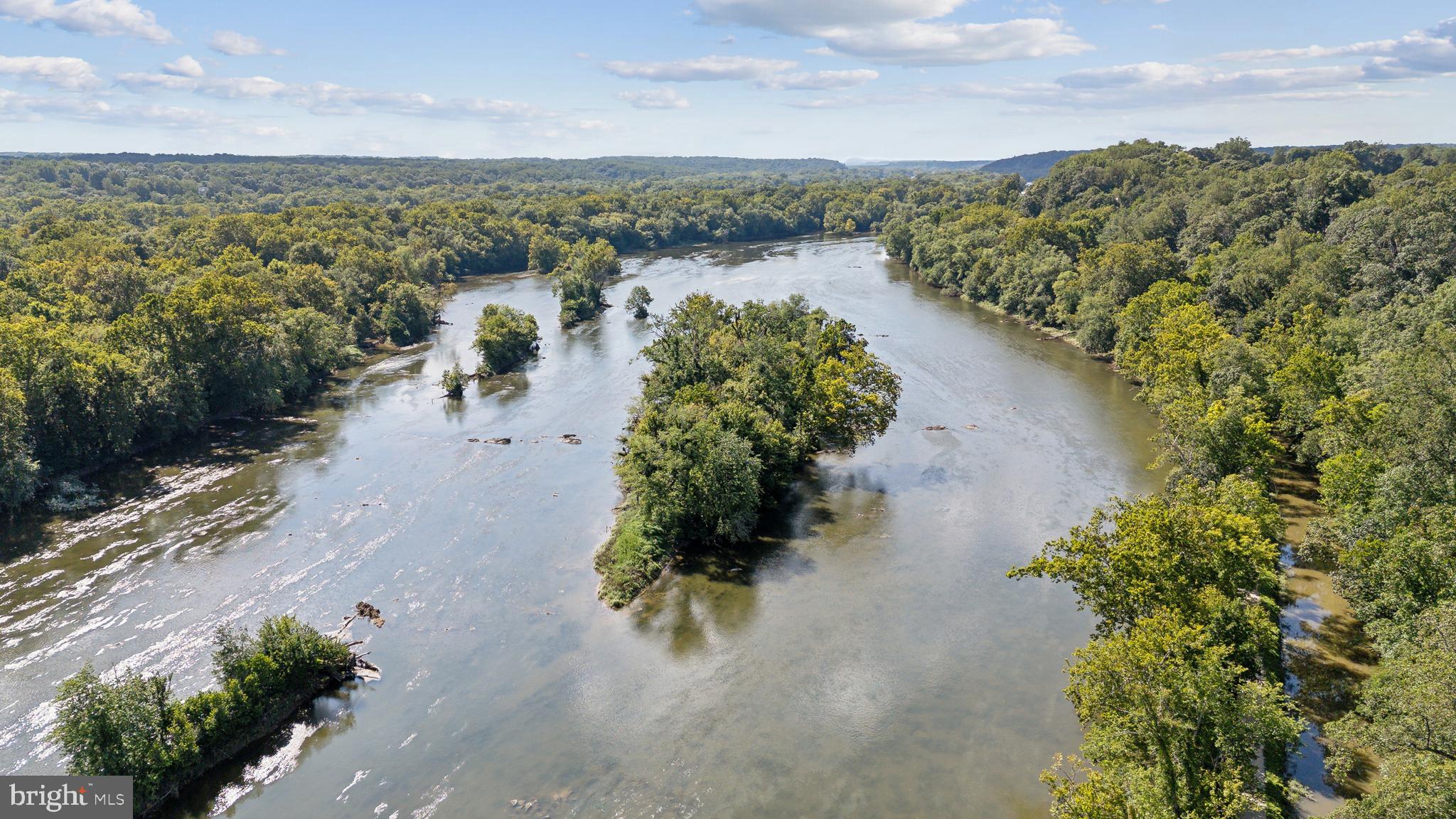 11540 Springridge Road Potomac, MD 20854 - Photo 32 of 35 a view of a lake with mountains in the background
