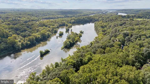 a view of a lake with mountains in the background