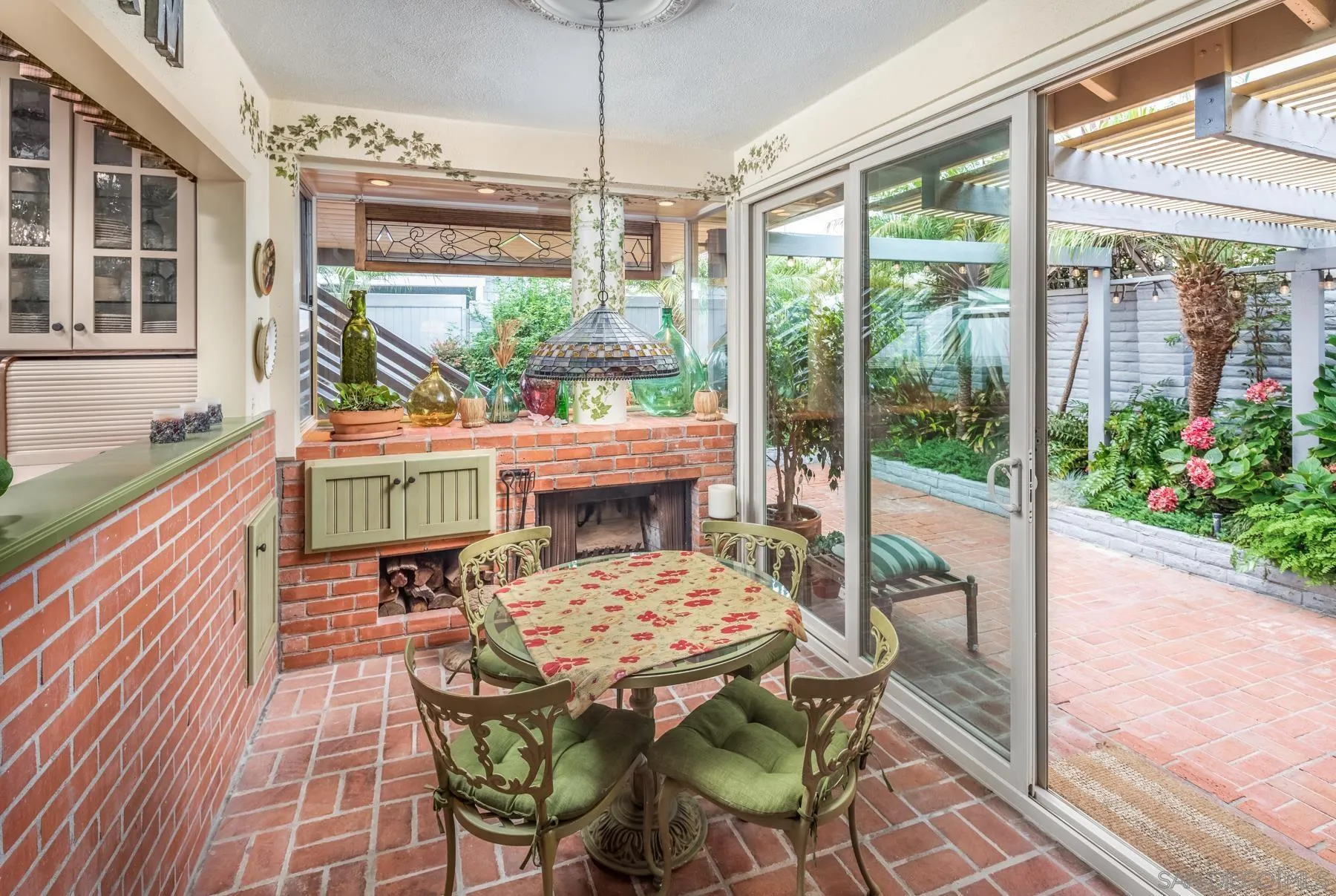 5118 Shore Drive Carlsbad, CA 92008 - Photo 14 of 21 a view of a patio with a table chairs and a barbeque