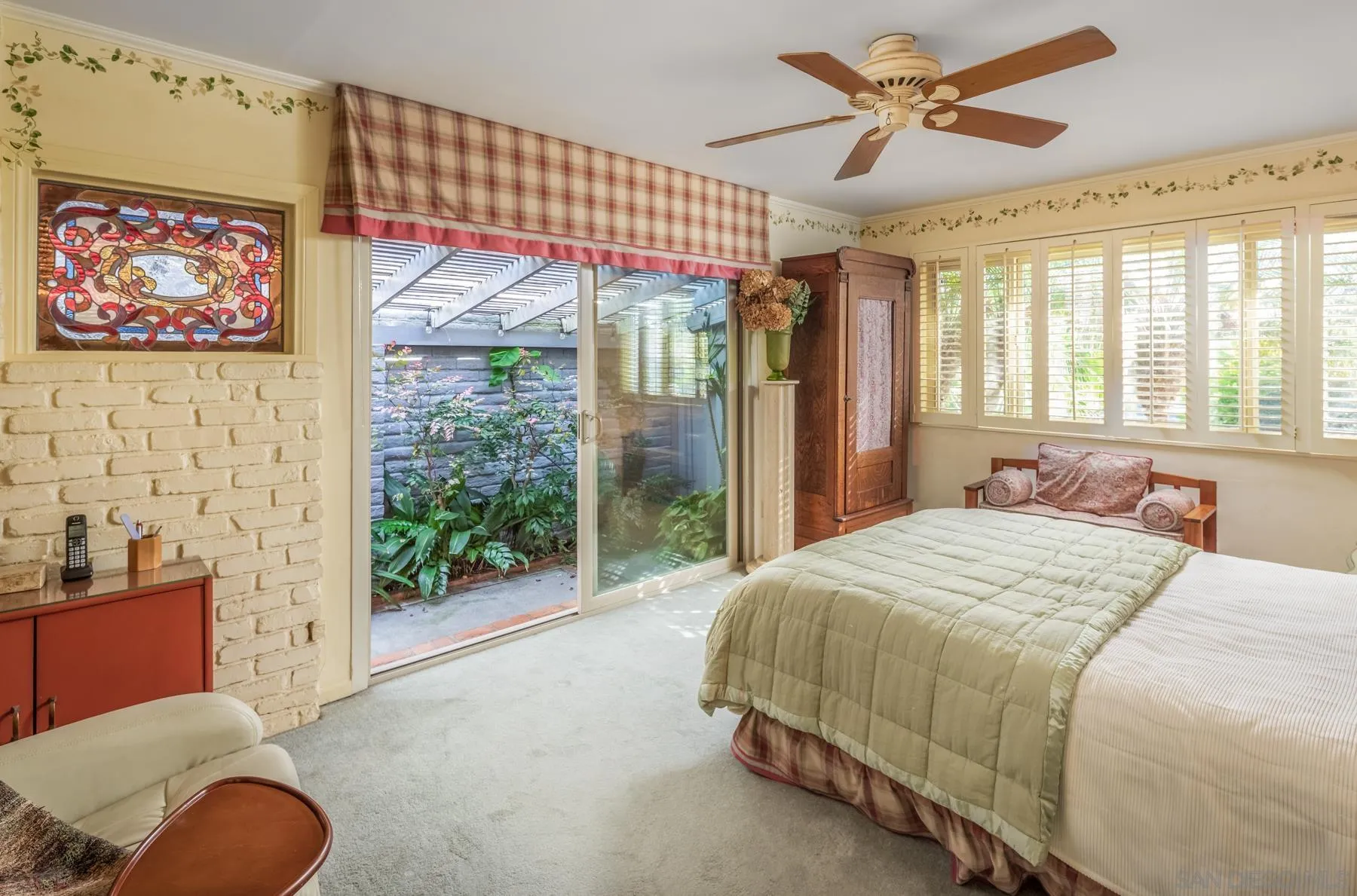 5118 Shore Drive Carlsbad, CA 92008 - Photo 15 of 21 a bedroom with a bed and a painting on the wall