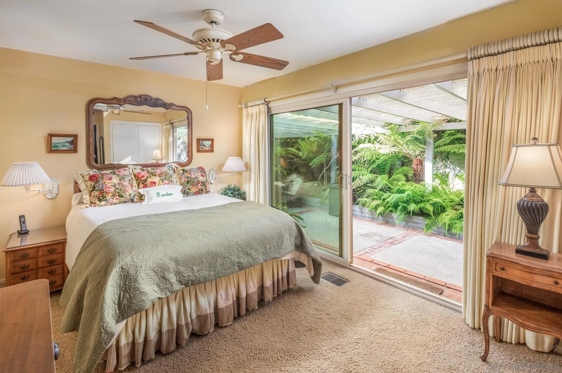 5118 Shore Drive Carlsbad, CA 92008 - Photo 17 of 21 a bedroom with a bed and a chandelier