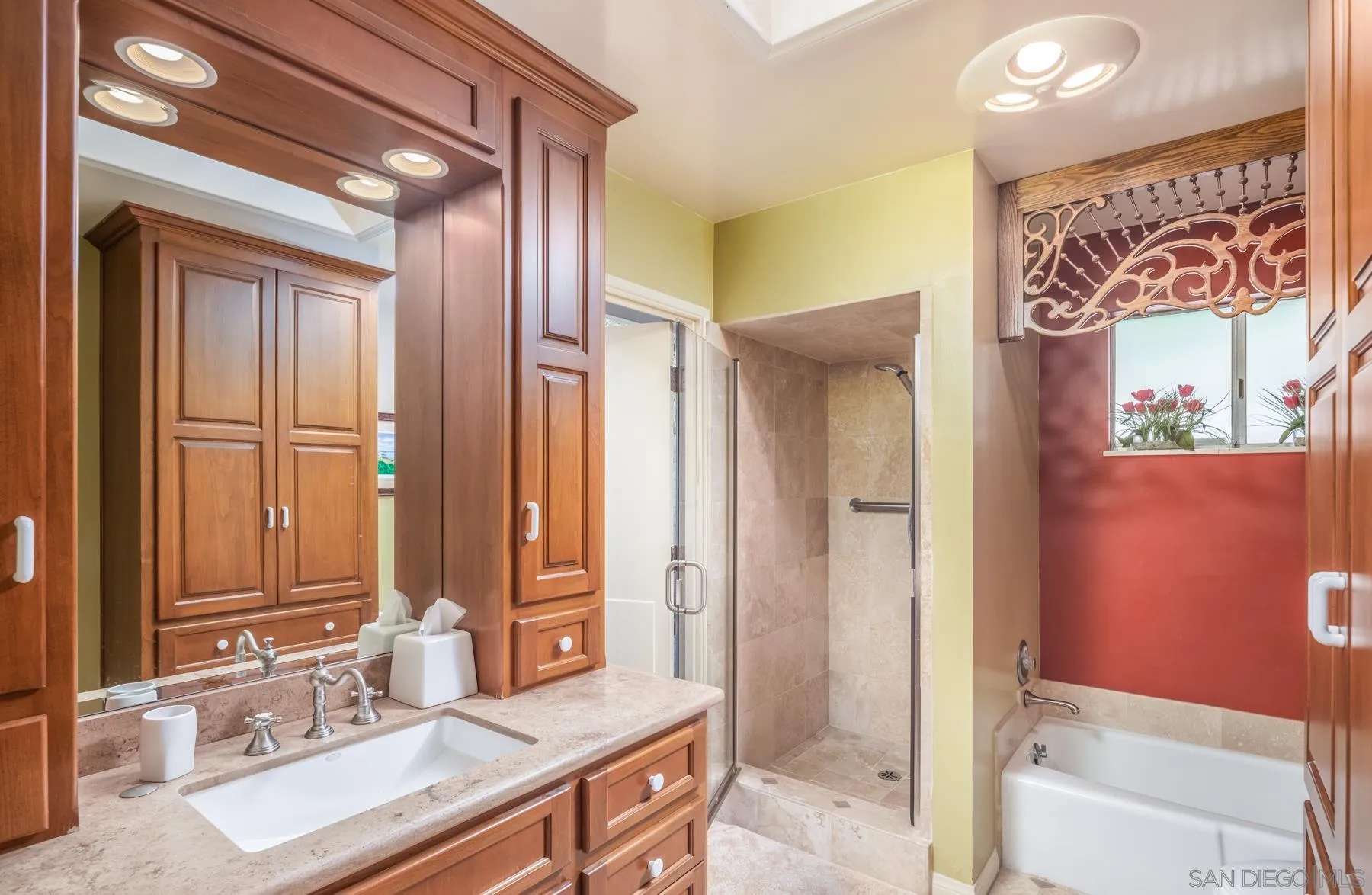 5118 Shore Drive Carlsbad, CA 92008 - Photo 18 of 21 a bathroom with a granite countertop tub sink and mirror