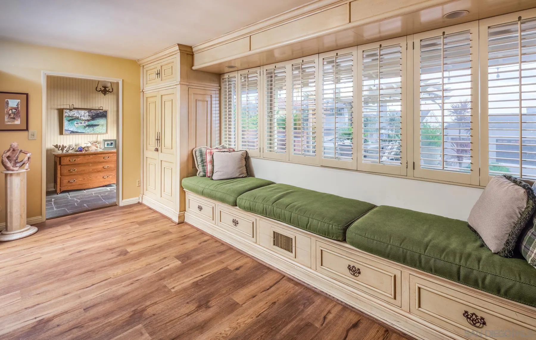 5118 Shore Drive Carlsbad, CA 92008 - Photo 10 of 21 a living room with a bed and next to a window