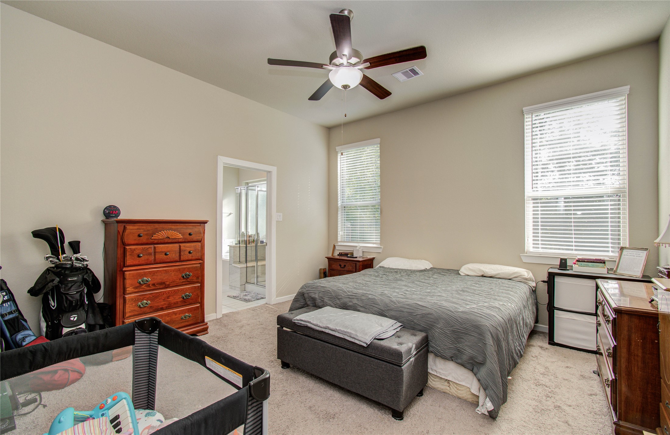22290 Rustling Cone Court Porter, TX 77365 - Photo 15 of 30 a bedroom with a bed and a dresser