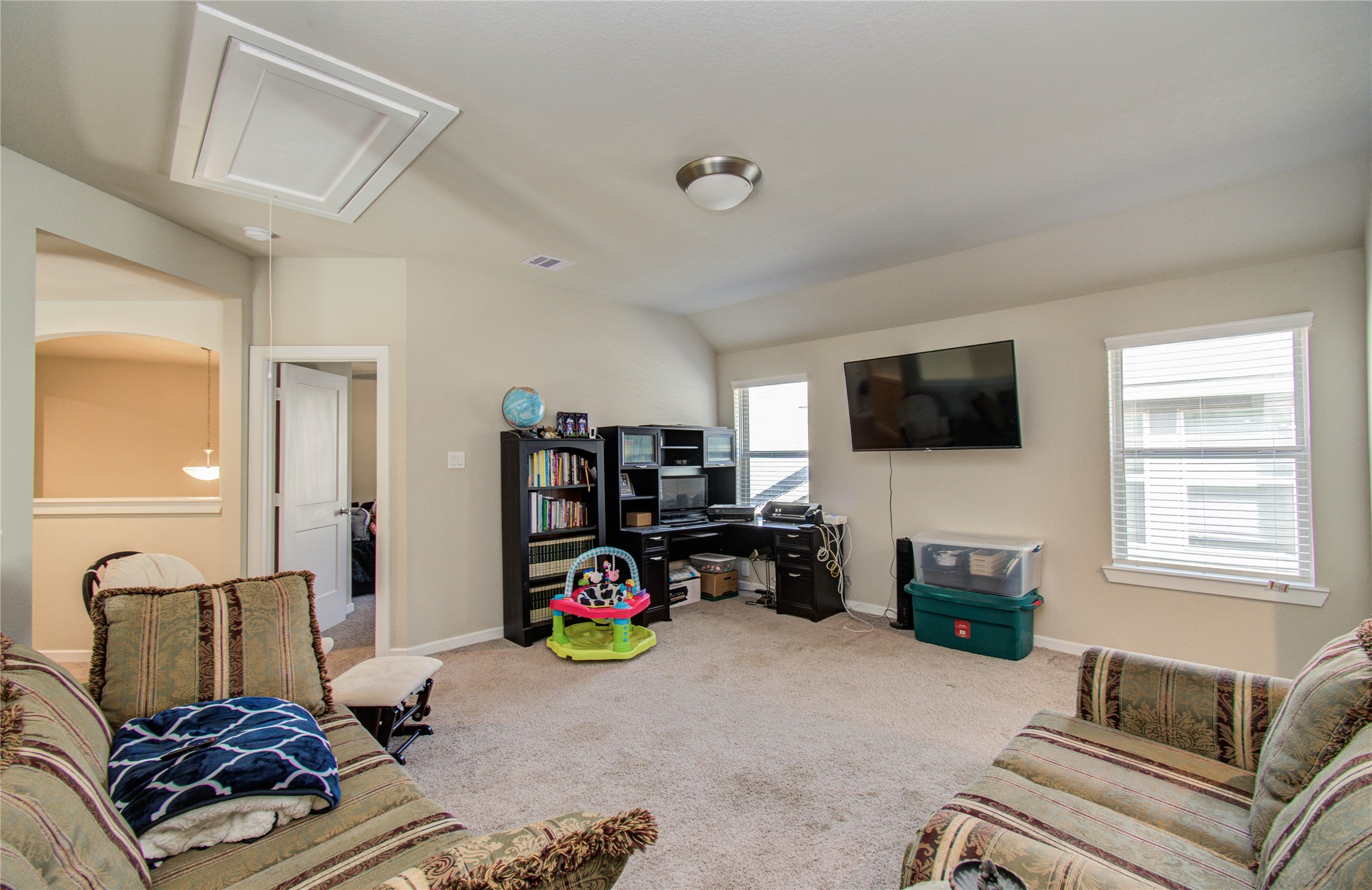 22290 Rustling Cone Court Porter, TX 77365 - Photo 21 of 30 a bedroom with furniture and a flat screen tv