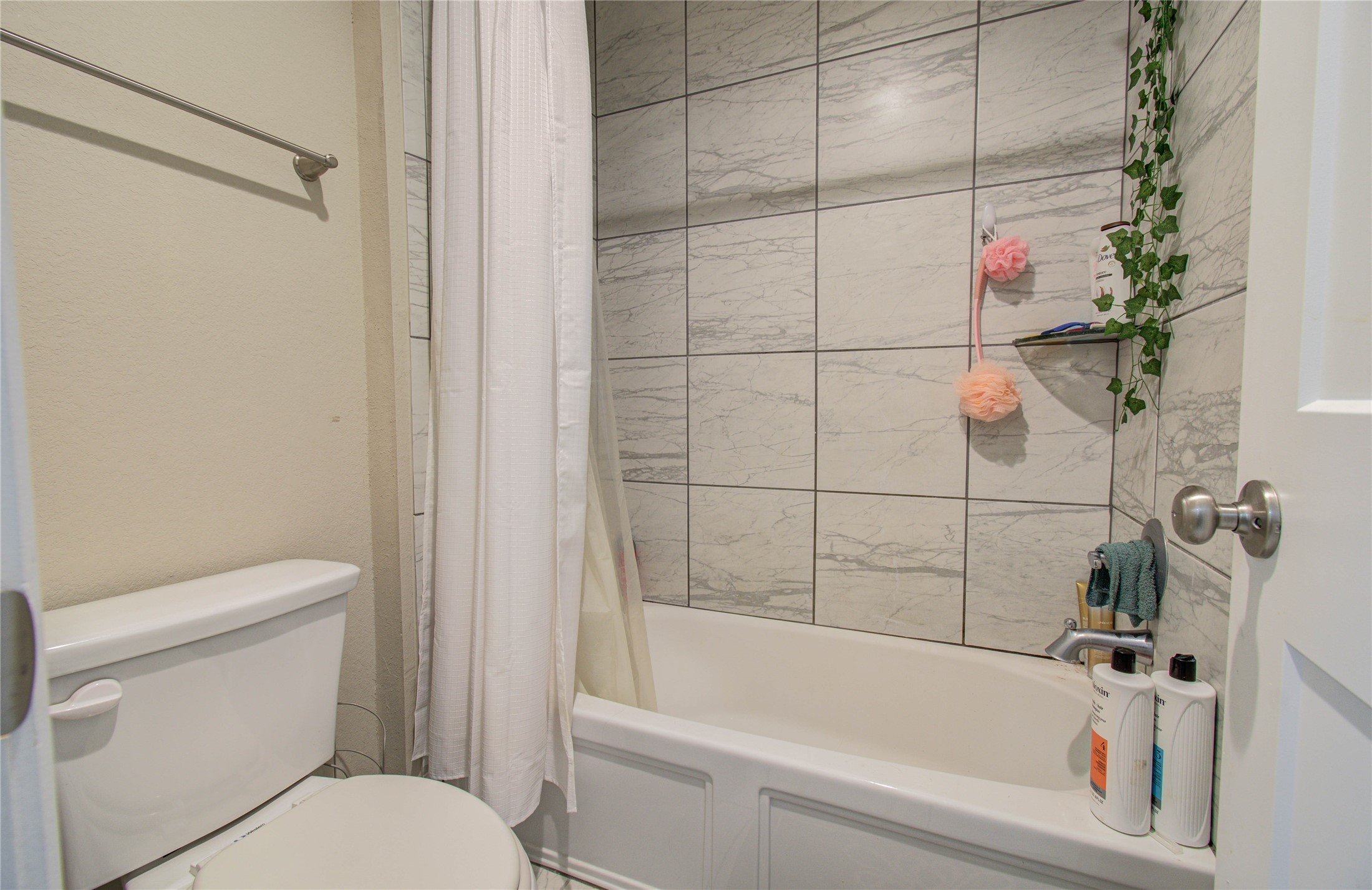 22290 Rustling Cone Court Porter, TX 77365 - Photo 23 of 30 a bathroom with a bathtub and a toilet
