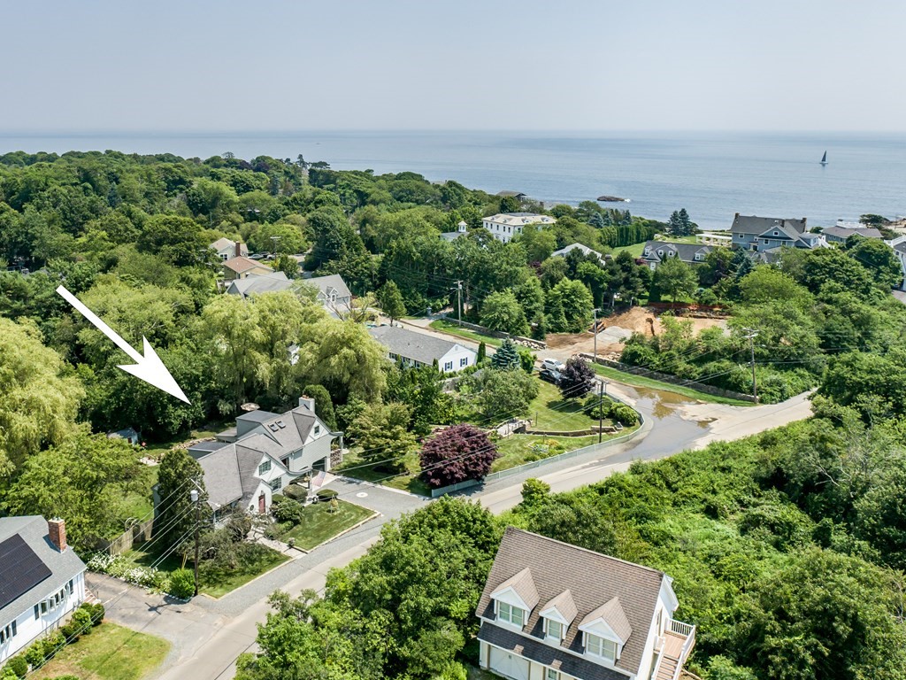 64 Grapevine Road Gloucester, MA 01930 - Photo 1 of 26 an aerial view of a residential houses with outdoor space and trees all around