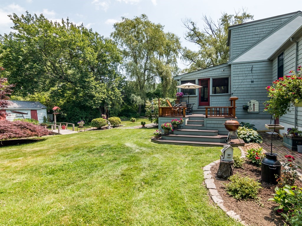 64 Grapevine Road Gloucester, MA 01930 - Photo 11 of 26 a swimming pool with outdoor seating and yard